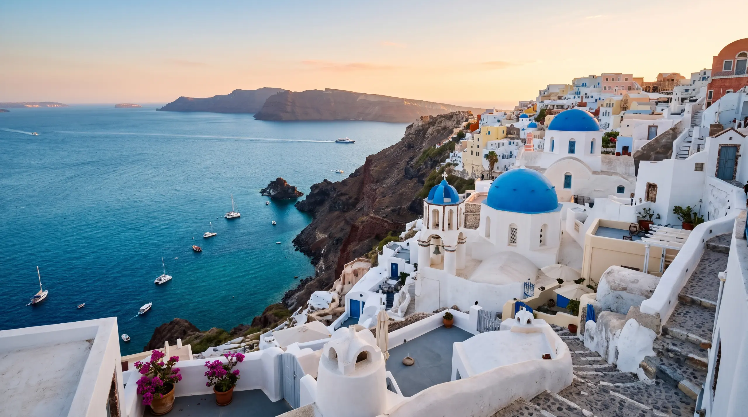 The blue-domed white churches of Oia, Santorini, above the Aegean caldera at golden hour