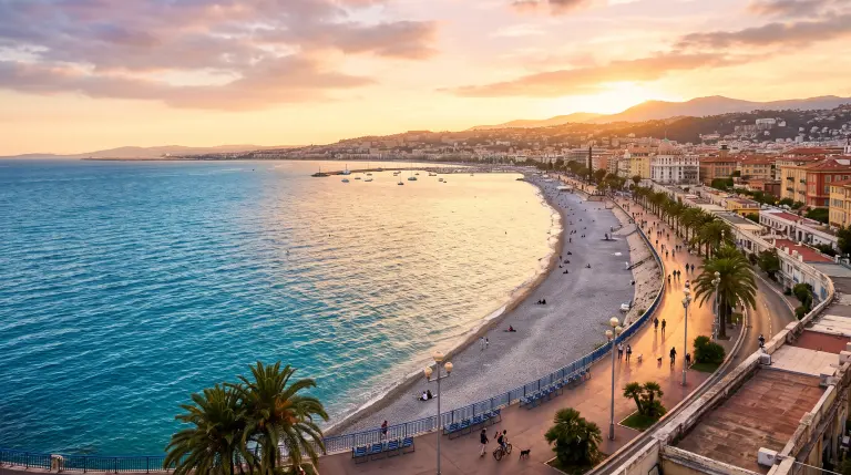 Nice's Promenade des Anglais curving along the turquoise Baie des Anges at golden hour
