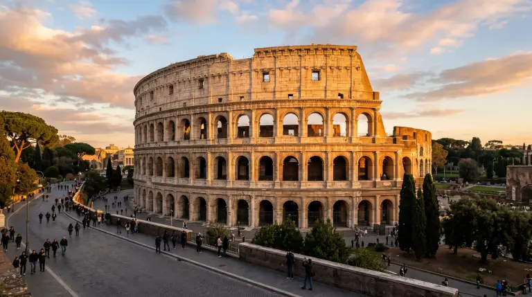 The Colosseum in Rome at golden hour, warm light on its ancient stone arches