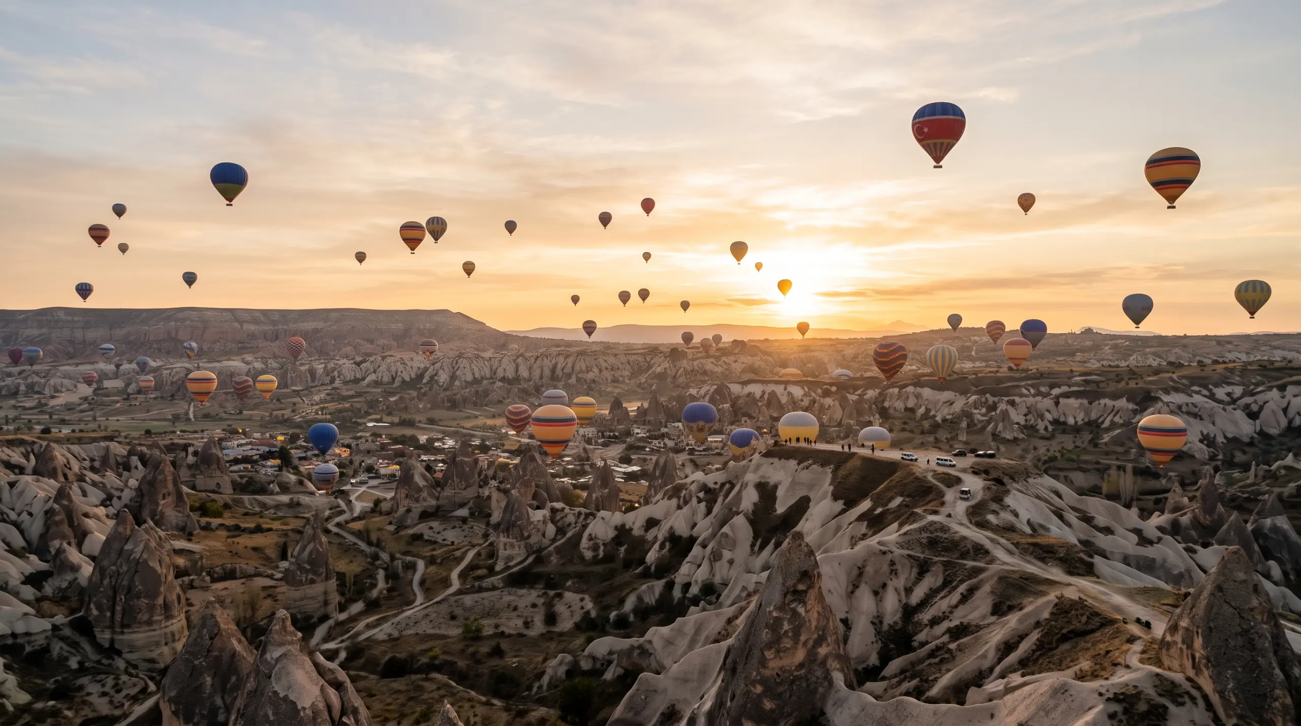 Hot-air balloons over the fairy chimneys of Cappadocia at sunrise